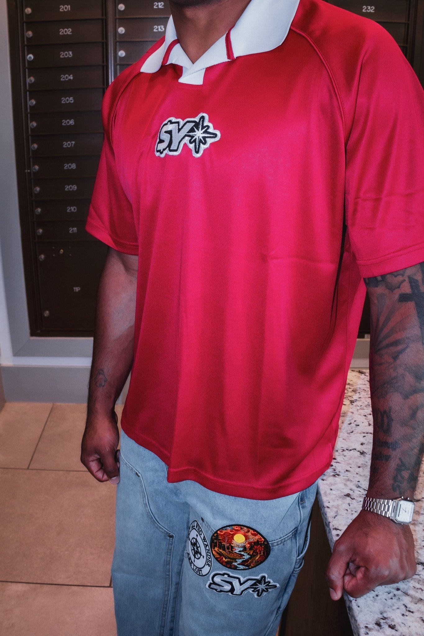 Red Polo Jersey - Stranded Youth Worldwide